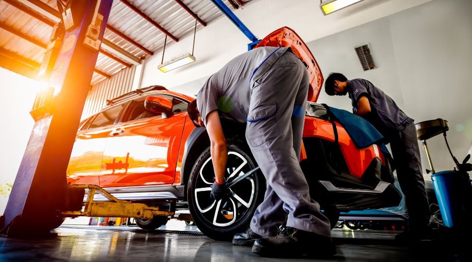 orange car in repair garage