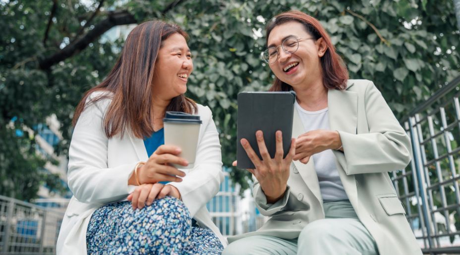 women talking with an ipad