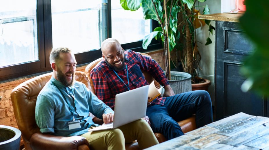 people in a meeting on a sofa