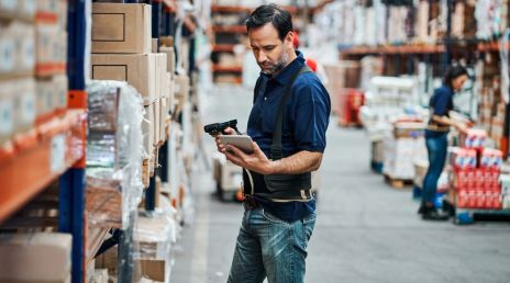 Warehouse employee with a digital device 
