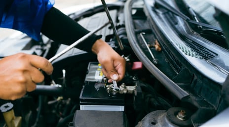 Person fixing a car