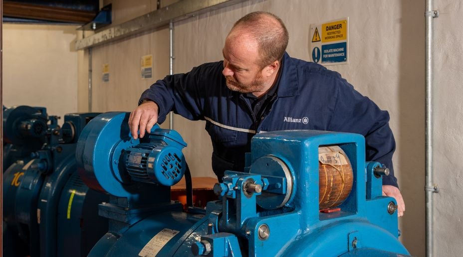 allianz engineer inspecting a pressure system