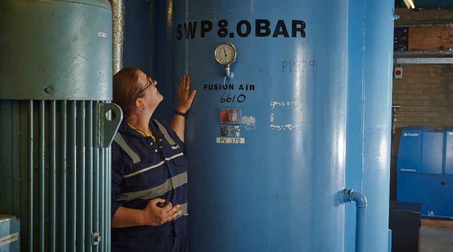 allianz engineer inspecting a pressure system