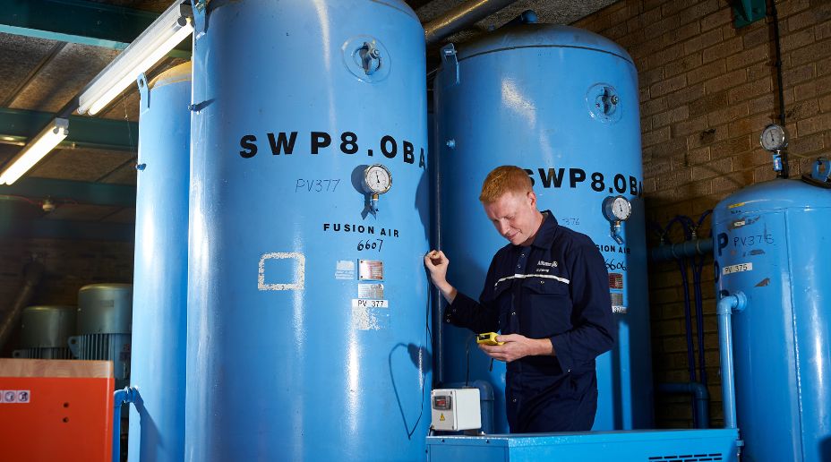 allianz engineer inspecting a pressure system