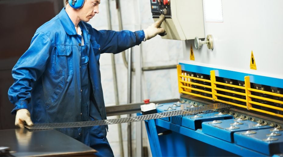 man using a power press