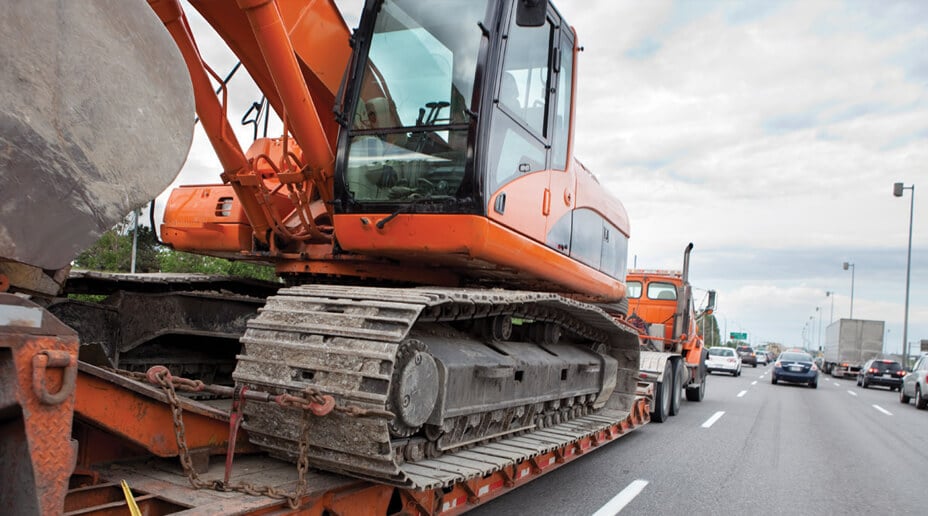 A young man with a large backpack on.