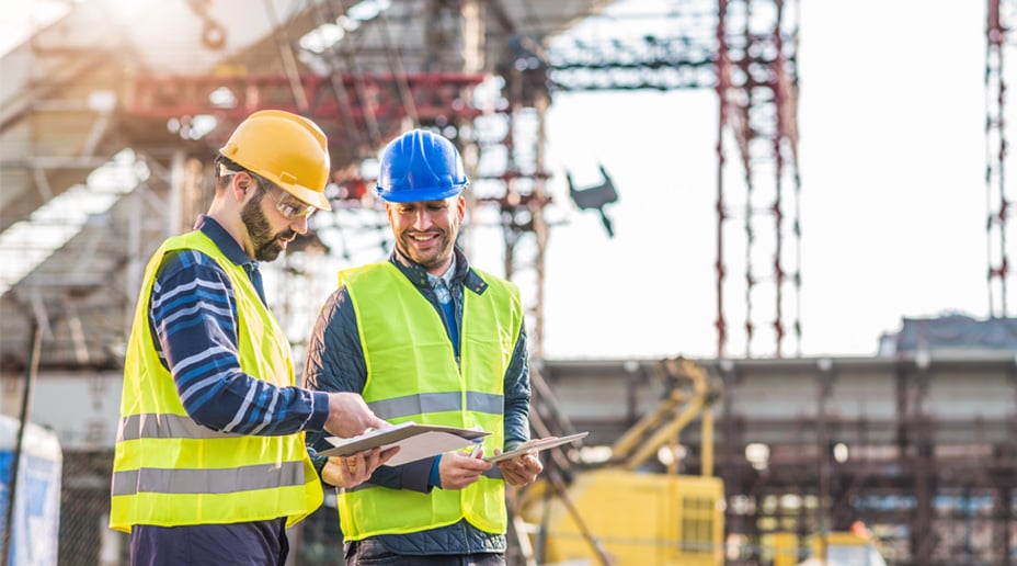 A young man with a large backpack on.