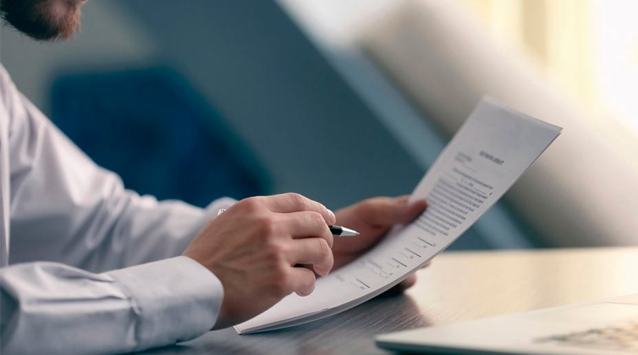 person reading through legal documents