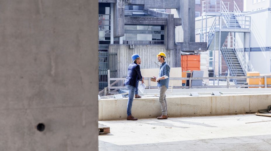 men talking on a construction site