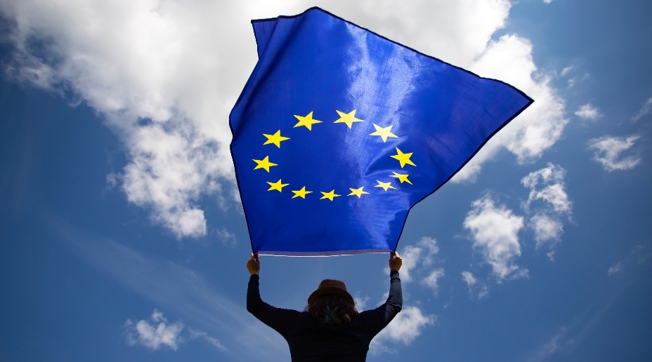 Woman holding EU flag 