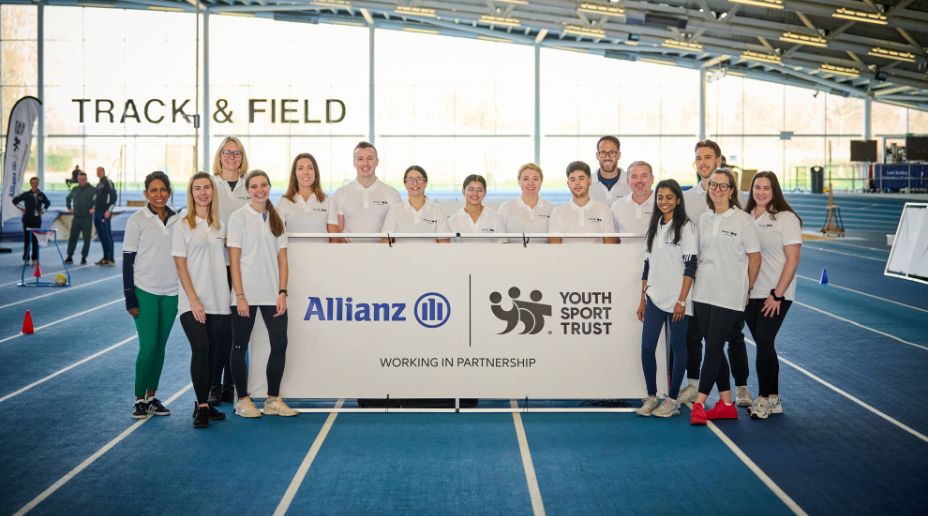 allianz volunteers with the youthsport trust banner
