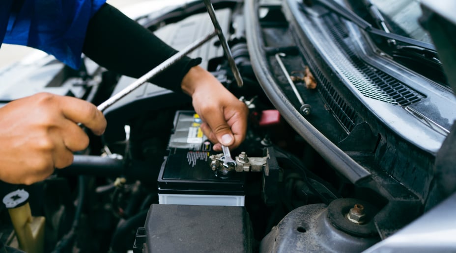 Person fixing a car