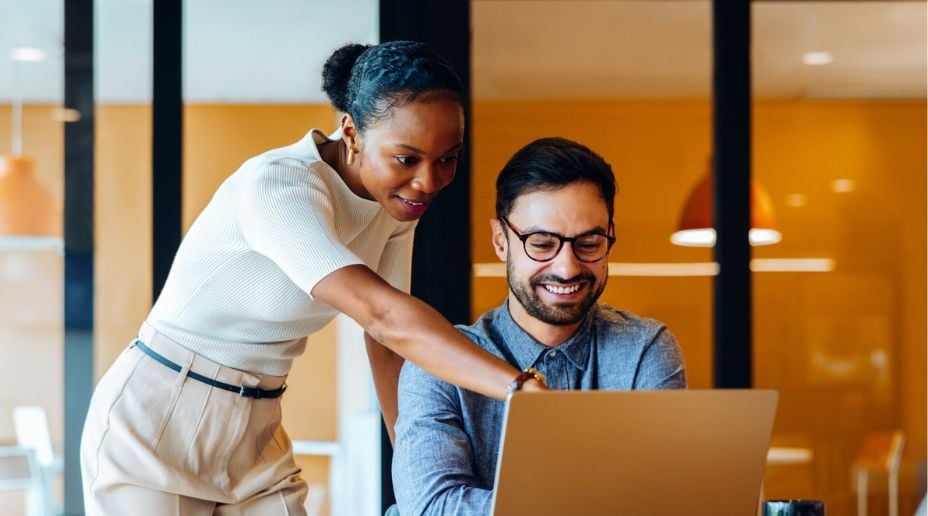 Two people and a laptop