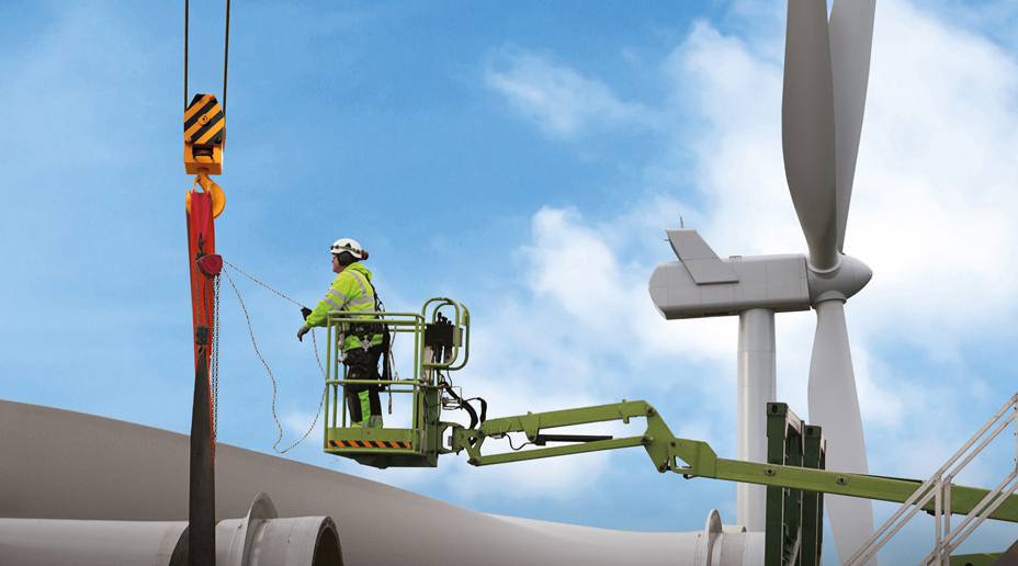engineers inspecting a wind turbine